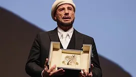 Palme surprise au festival de Cannes : John Travolta reçoit une palme d’honneur inattendue !